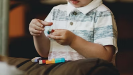 A little child playing with toys